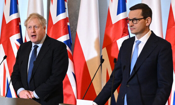 British Prime Minister Boris Johnson (L) and Polish Prime Minister Mateusz Morawiecki give a press conference at the Chancellery in Warsaw, Poland, on March 1, 2022. (Leon Neal /Pool/AFP via Getty Images)