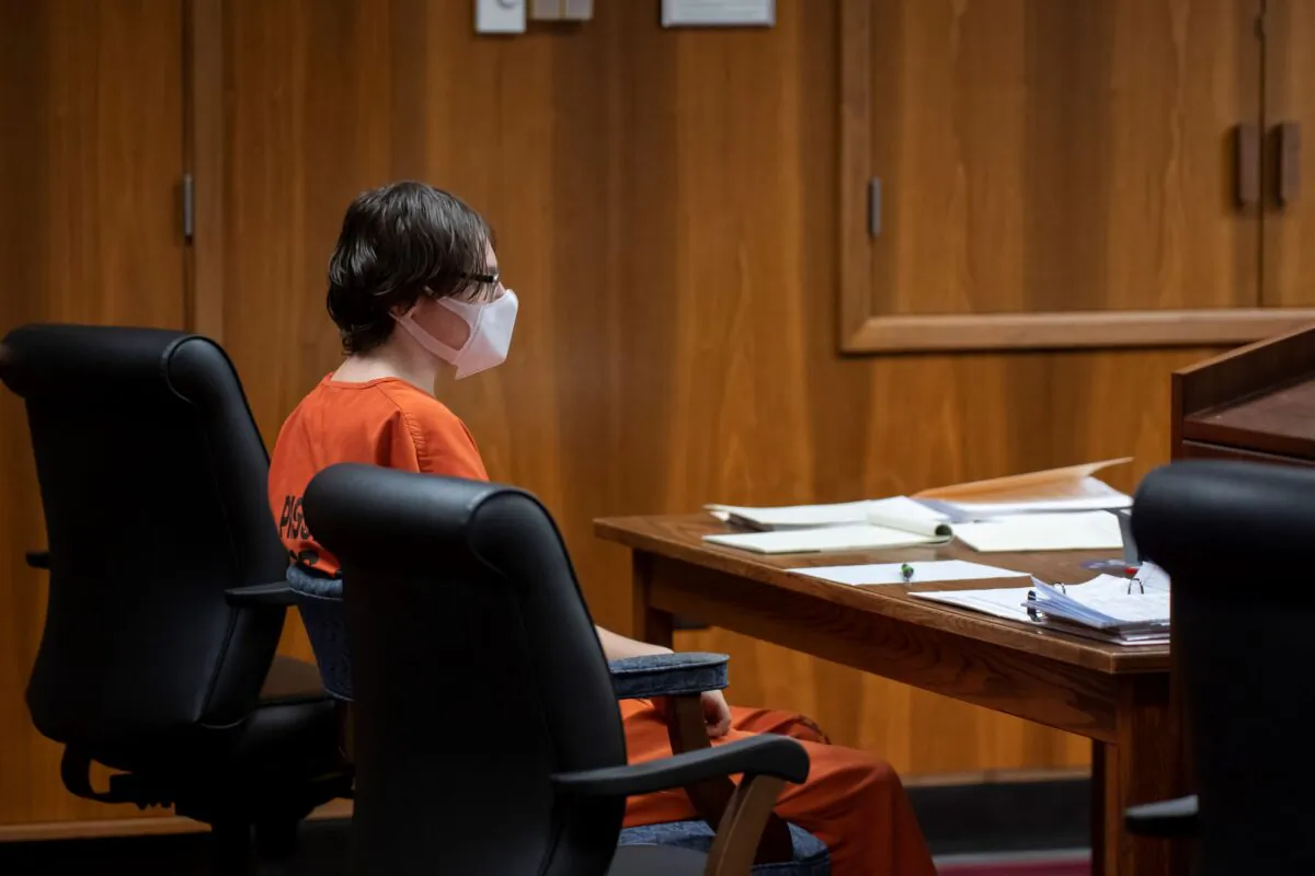 Ethan Crumbley sits by himself while attorneys confer with the judge during a placement hearing at Oakland County Circuit Court in Pontiac, Mich., on Feb. 22, 2022. (David Guralnick/Getty Images)