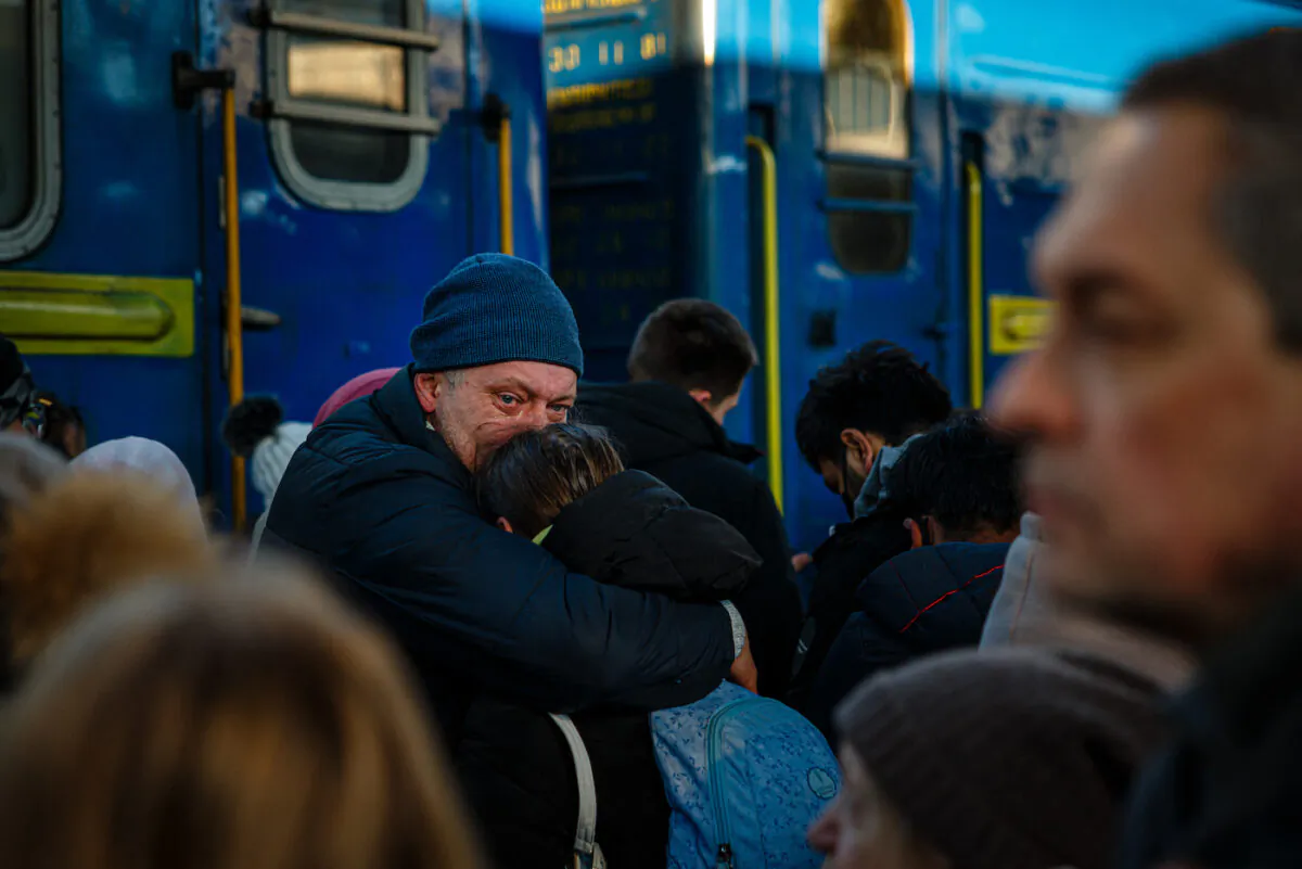 A man says goodbye to his daughter before she boards an evacuation train at Kyiv central train station on Feb. 28, 2022. (Dimitar Dilkoff/AFP via Getty Images)