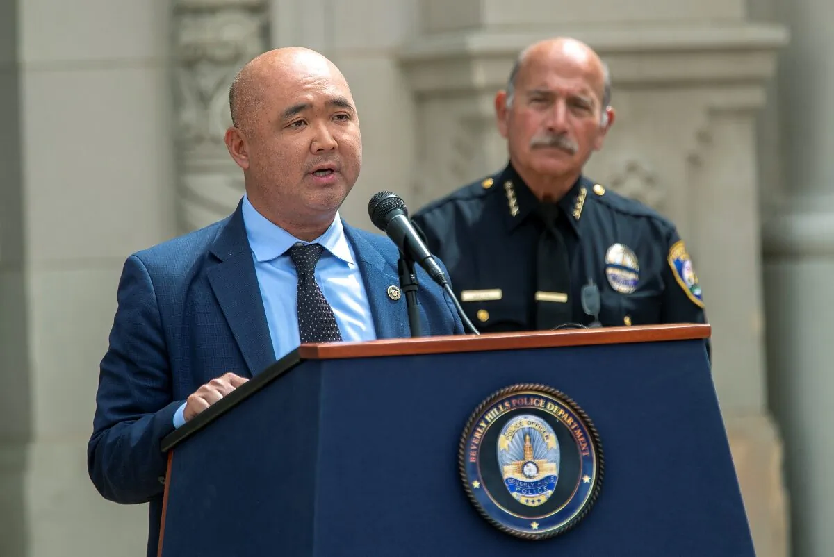 Matthew Moon, left, special agent in charge of the criminal division, FBI, addresses the media outside of Beverly Hills City Hall to talk about the arrest of three gang members in Los Angeles, on Feb. 28, 2022. (Mel Melcon/Los Angeles Times/TNS)