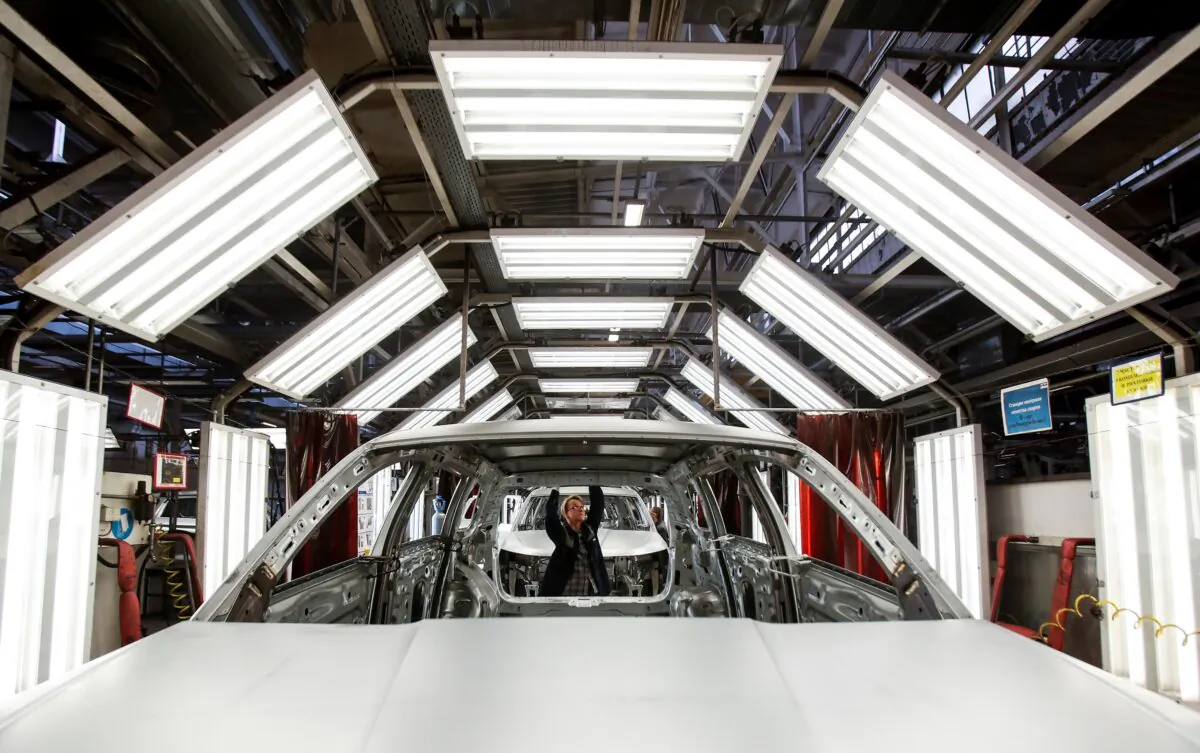 An employee works on the chassis of a Skoda automobile at the Gorkovsky Automobile Plant (GAZ) in Nizhny Novgorod, Russia on April 16, 2019. (Maxim Shemetov/Reuters)
