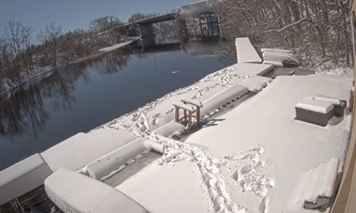 In this video still, tracks leading to the Charles River is seen in Massachusetts, on Feb. 26, 2022. (State Police Association of Massachuset via AP/Screenshot via The Epoch Times)