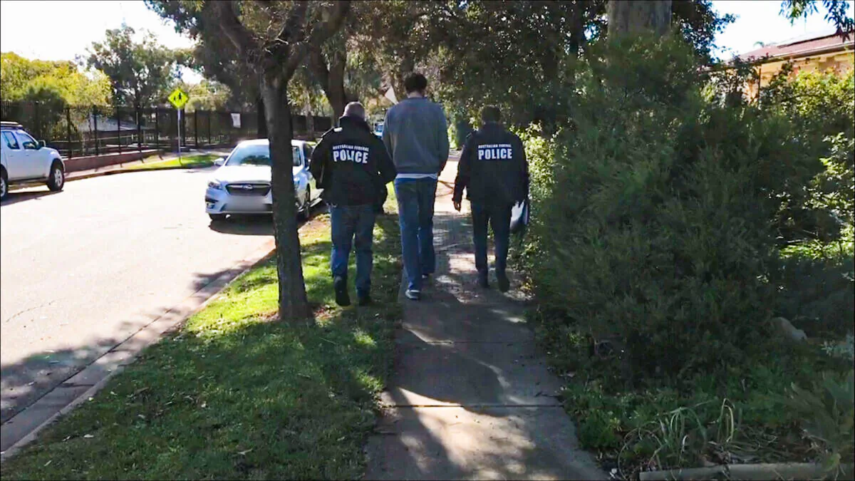 In this undated photo, the Australian Federal Police (AFP) make an arrest for Operation Molto in the suburb of Ingle Farm in Adelaide, Australia. (AFP)