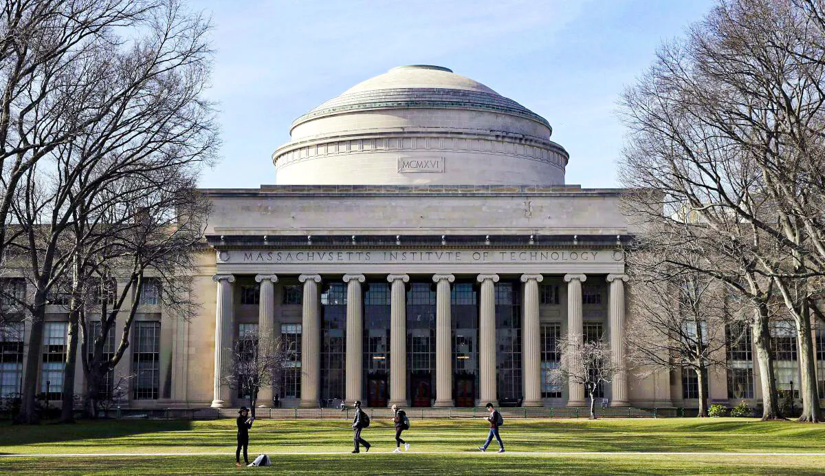 In this April 3, 2017 file photo, students walk past the "Great Dome" atop Building 10 on the Massachusetts Institute of Technology campus in Cambridge, Mass. Two prominent researchers are quitting MIT's Media Lab over revelations that the famed technology research hub and its director took money from Jeffrey Epstein after he'd served time for sex offenses involving girls and young women. Ethan Zuckerman, director of the lab's Center for Civic Media, said director Joi Ito had failed to disclose the deceased financier's funding of the Massachusetts Institute of Technology incubator as well as investments Epstein made in Ito's personal venture capital fund, Wednesday, Aug. 21, 2019. (AP Photo/Charles Krupa, File)