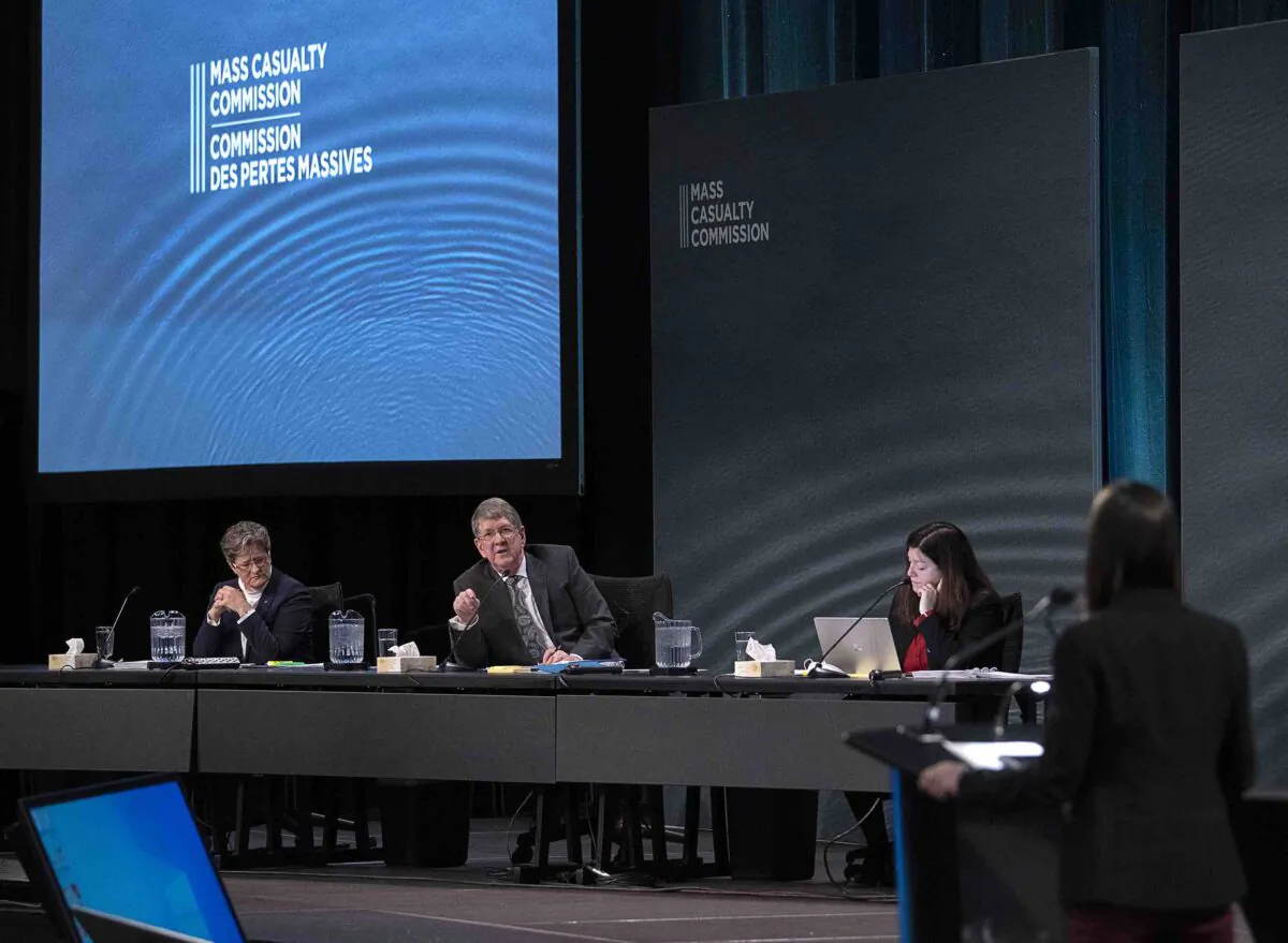 Michael MacDonald, chair, flanked by fellow commissioners Leanne Fitch, left, and Kim Stanton, responds to Sandra McCulloch, right, a lawyer with Patterson Law representing some family members, at the Mass Casualty Commission inquiry into the mass murders in rural Nova Scotia on April 18/19, 2020, in Halifax on March 2, 2022. (The Canadian Press/Andrew Vaughan)
