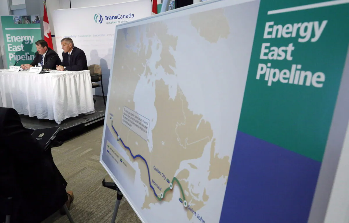 The now-cancelled Energy East pipeline’s proposed route is pictured during a news conference in a file photo. (The Canadian Press/Jeff McIntosh)