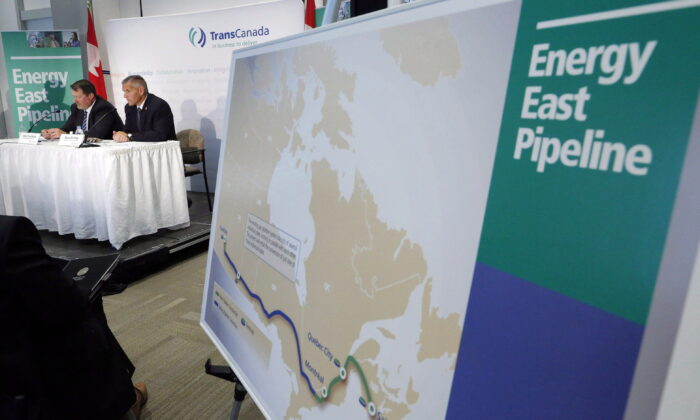 The Energy East pipeline’s proposed route is pictured as TransCanada officials speak during a news conference in this file photo. Amid Russia’s invasion of Ukraine, many are calling for greater Canadian energy security and less dependence on foreign imports, with a pipeline running from east to west being a key component of the strategy. (The Canadian Press/Jeff McIntosh)