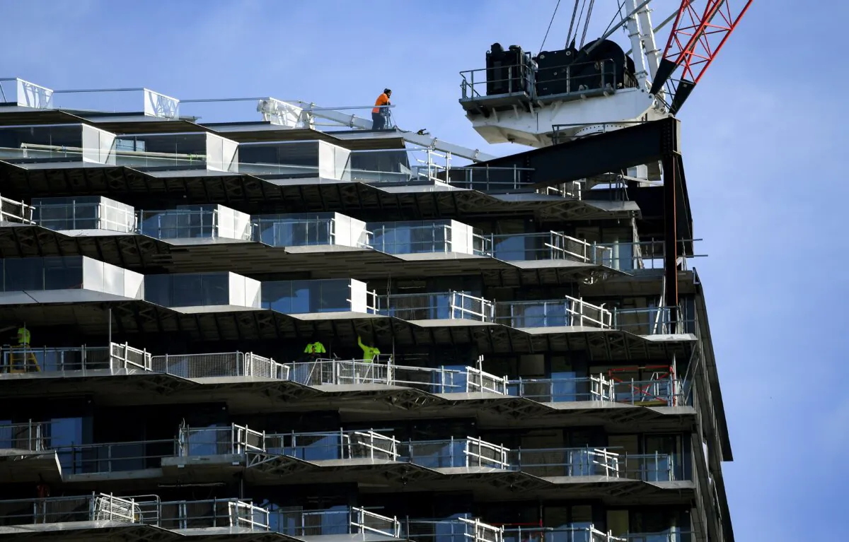 A worker looks out over a construction site in Melbourne, Australia, on March 30, 2020. (William West/AFP via Getty Images)