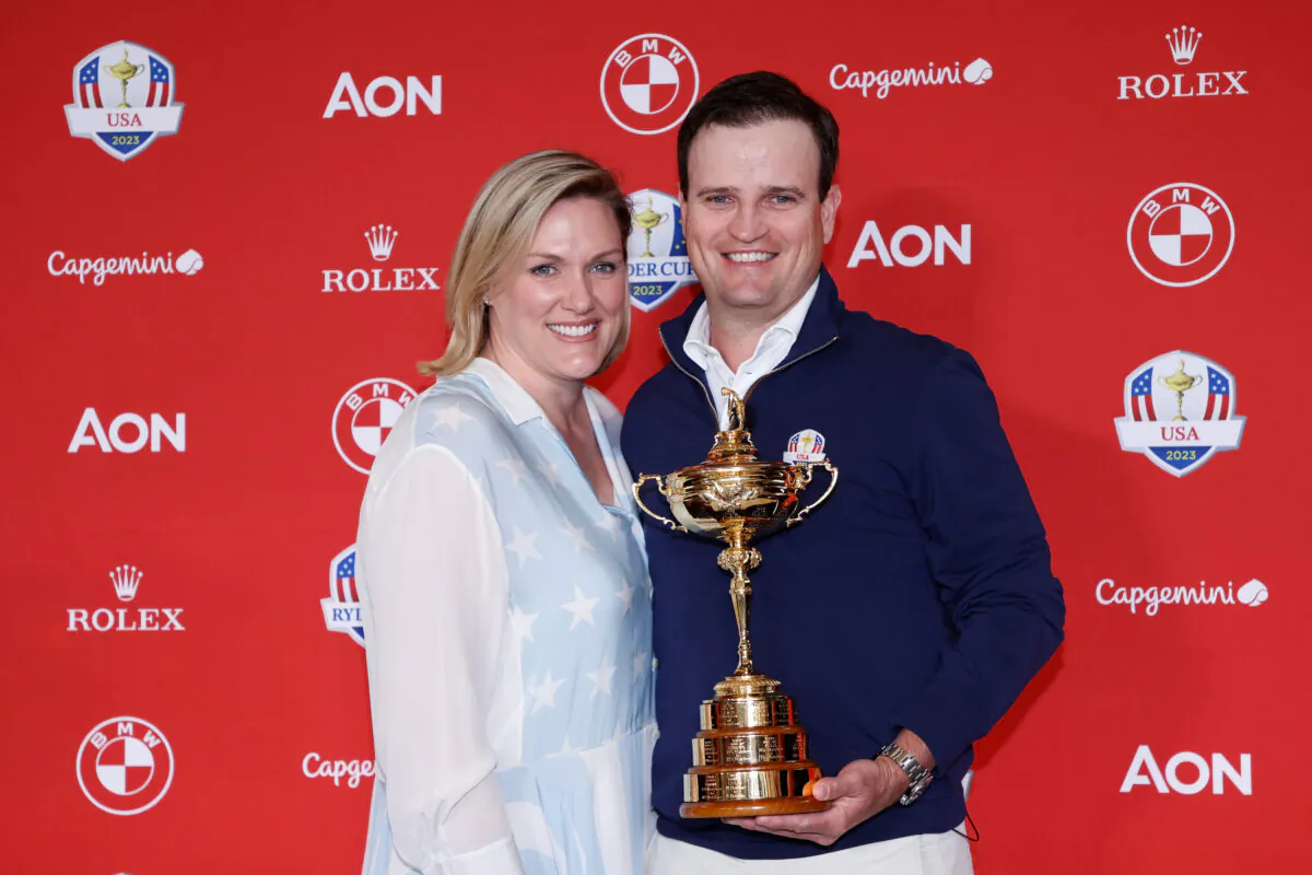 Zach Johnson and wife Kim Barclay pose after Johnson was announced as United States Ryder Cup Captain for 2023 during a press conference at PGA of America Headquarters in Palm Beach Gardens, Fla., on Feb. 28, 2022. (Cliff Hawkins/Getty Images)