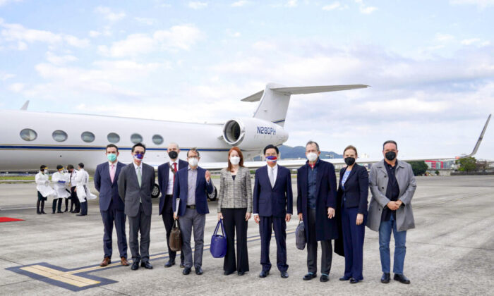 Taiwan's Foreign Minister Joseph Wu (4th R) stands with a U.S. delegation including retired Admiral Mike Mullen (3rd R), former chair of the Joint Chiefs of Staff, as they arrive at Taipei Songshan Airport in Taiwan on March 1, 2022. (Taiwan Ministry of Foreign Affairs via AP)