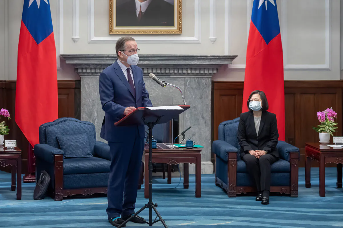 Former Chairman of the Joint Chiefs of Staff Mike Mullen speaks as Taiwan's president Tsai Ing-wen (R) listens during a meeting in Taipei, Taiwan, on March 2, 2022. (Taiwan Presidential Office via AP)