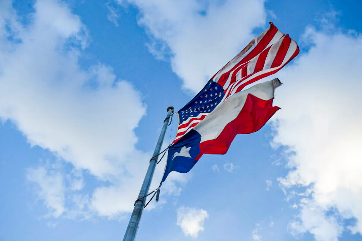 The United States Flag and Texas State Flag are displayed at Murchison Rogers Park in El Paso, Texas, on June 24, 2021. (Patrick T. Fallon/AFP/Getty Images)