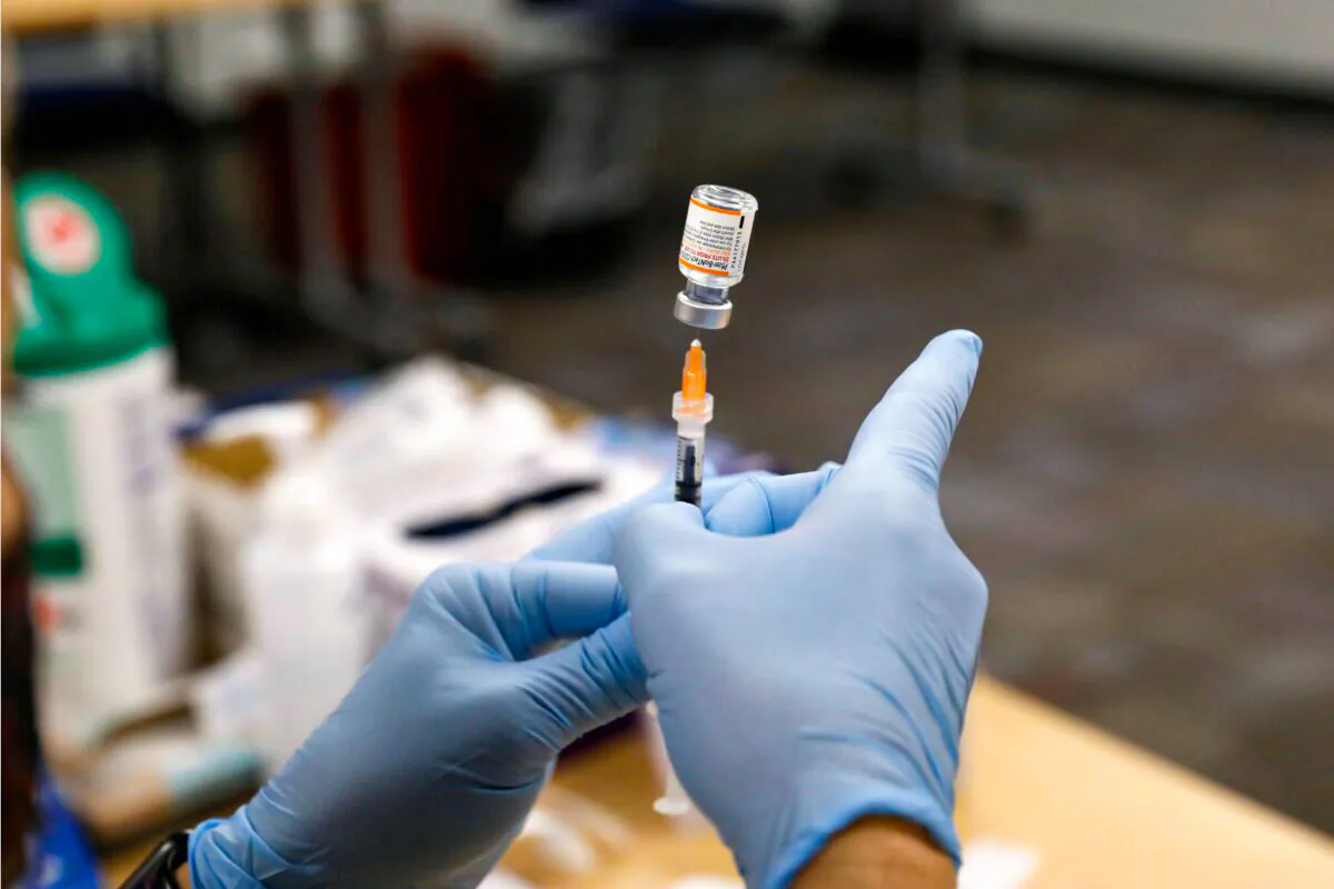 A nurse prepares the Pfizer COVID-19 vaccine in a file image. (Jeff Kowalsky/AFP via Getty Images)