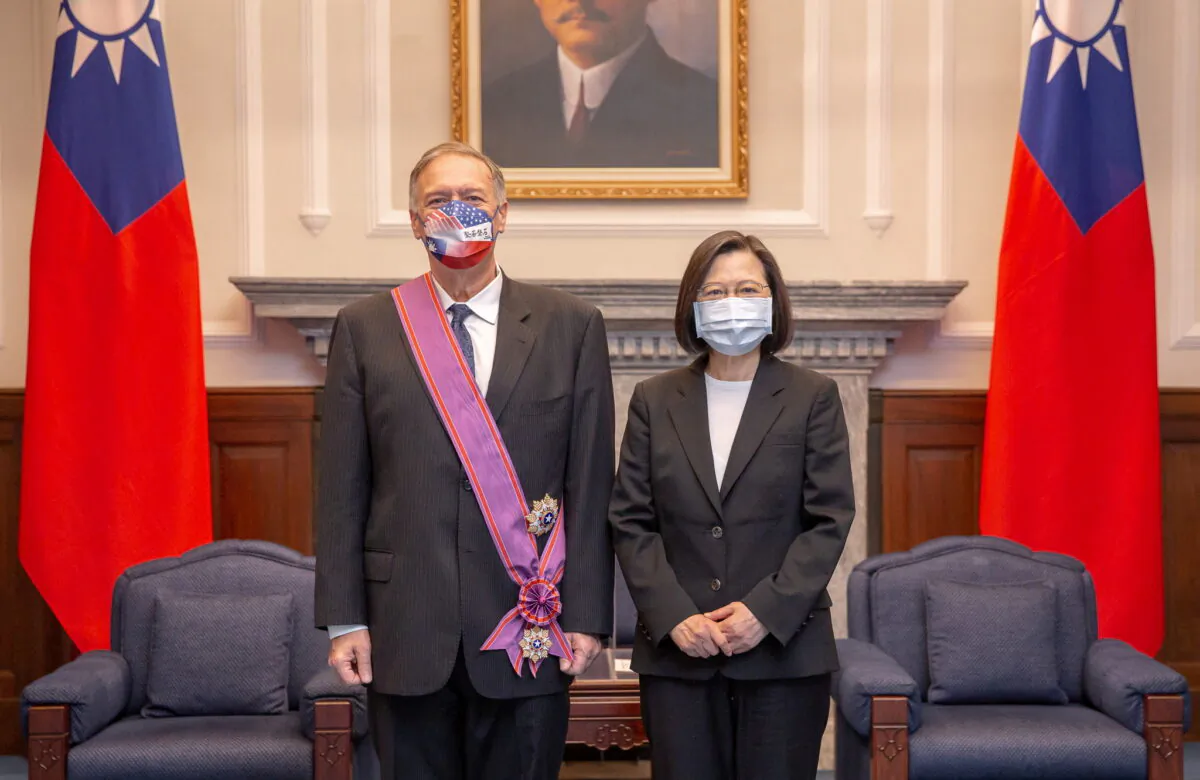 Taiwan's President Tsai Ing-wen with former U.S. Secretary of State Mike Pompeo after he was bestowed with an Order of Brilliant Star with Grand Cordon at the Presidential Building in Taipei on March 3, 2022. (Taiwan Presidential Office/Reuters)
