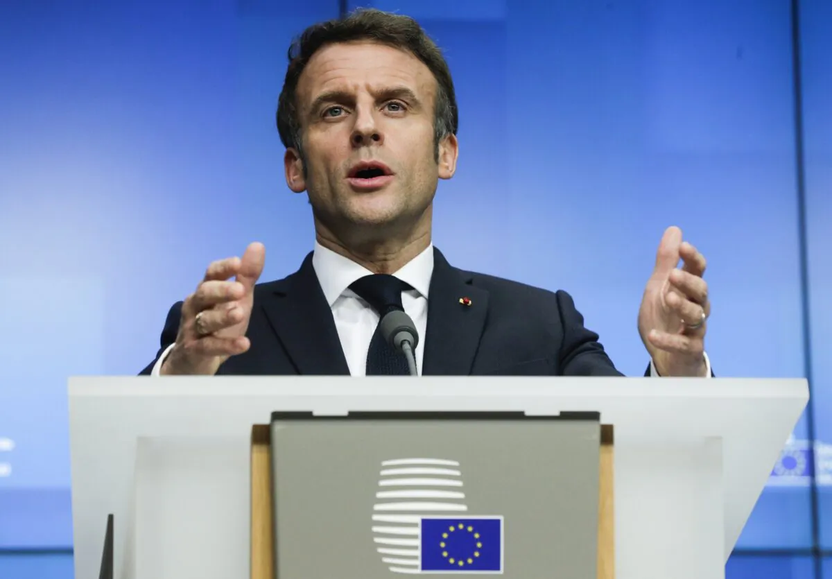 French President Emmanuel Macron speaks during a media conference after an extraordinary EU summit on Ukraine in Brussels, on Feb. 25, 2022. (Olivier Hoslet, Pool Photo via AP)