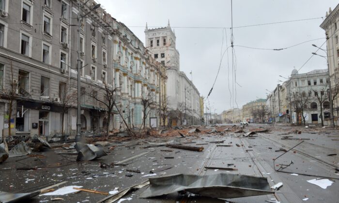 A picture shows damage after the shelling by Russian forces of Constitution Square in Kharkiv, Ukraine's second-biggest city, on March 2, 2022. (Sergey Bobok / AFP via Getty Images)