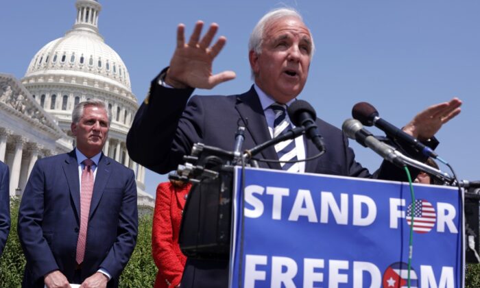 Rep. Carlos Gimenez (R-Fla.) (R) speaks as House Minority Leader Rep. Kevin McCarthy (R-Calif.) listens during McCarthy’s weekly news conference outside the U.S. Capitol in Washington, on May 20, 2021. (Alex Wong/Getty Images)