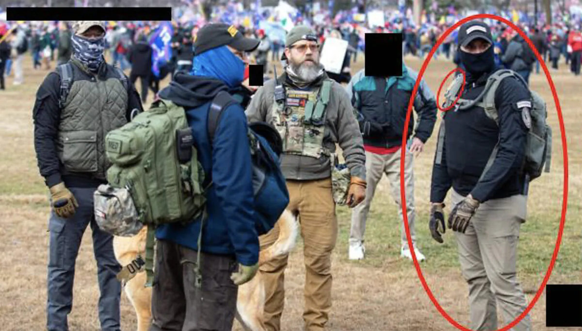 Joshua A. James (right) meets with other Oath Keepers outside of the U.S. Capitol on Jan. 6, 2021. (U.S. Department of Justice/Screenshot via The Epoch Times)