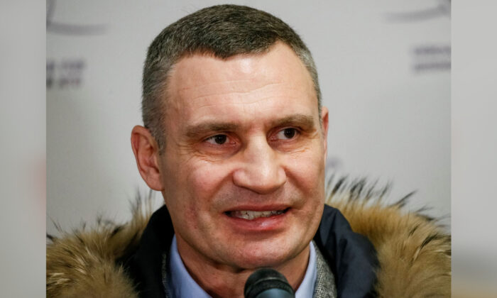 Mayor of Kyiv Vitaly Klitschko speaks with journalists during the opening of the first Ukrainian Territorial Defence Forces recruitment center in central Kyiv, Ukraine, on Feb. 2, 2022. (Gleb Garanich/Reuters)
