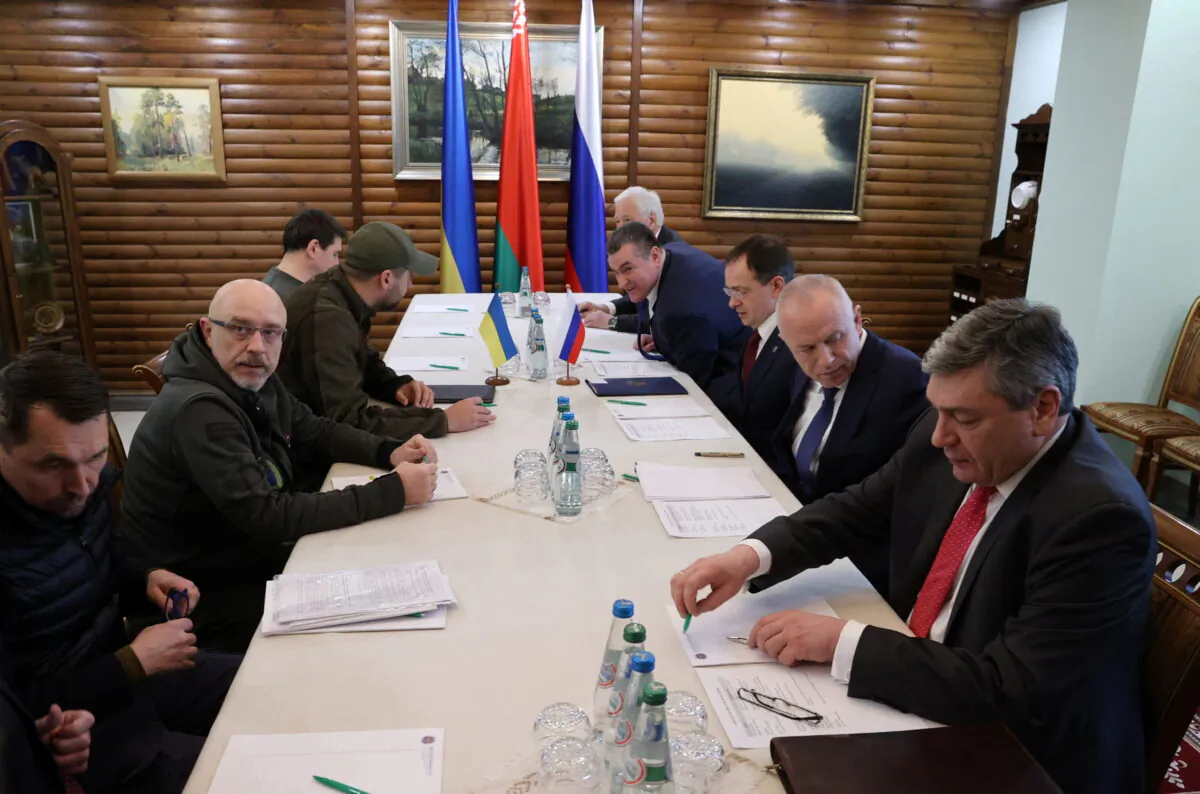 Russian and Ukrainian officials take part in the talks in the Brest region, Belarus, on March 3, 2022. (Maxim Guchek/BelTA/Handout via Reuters)