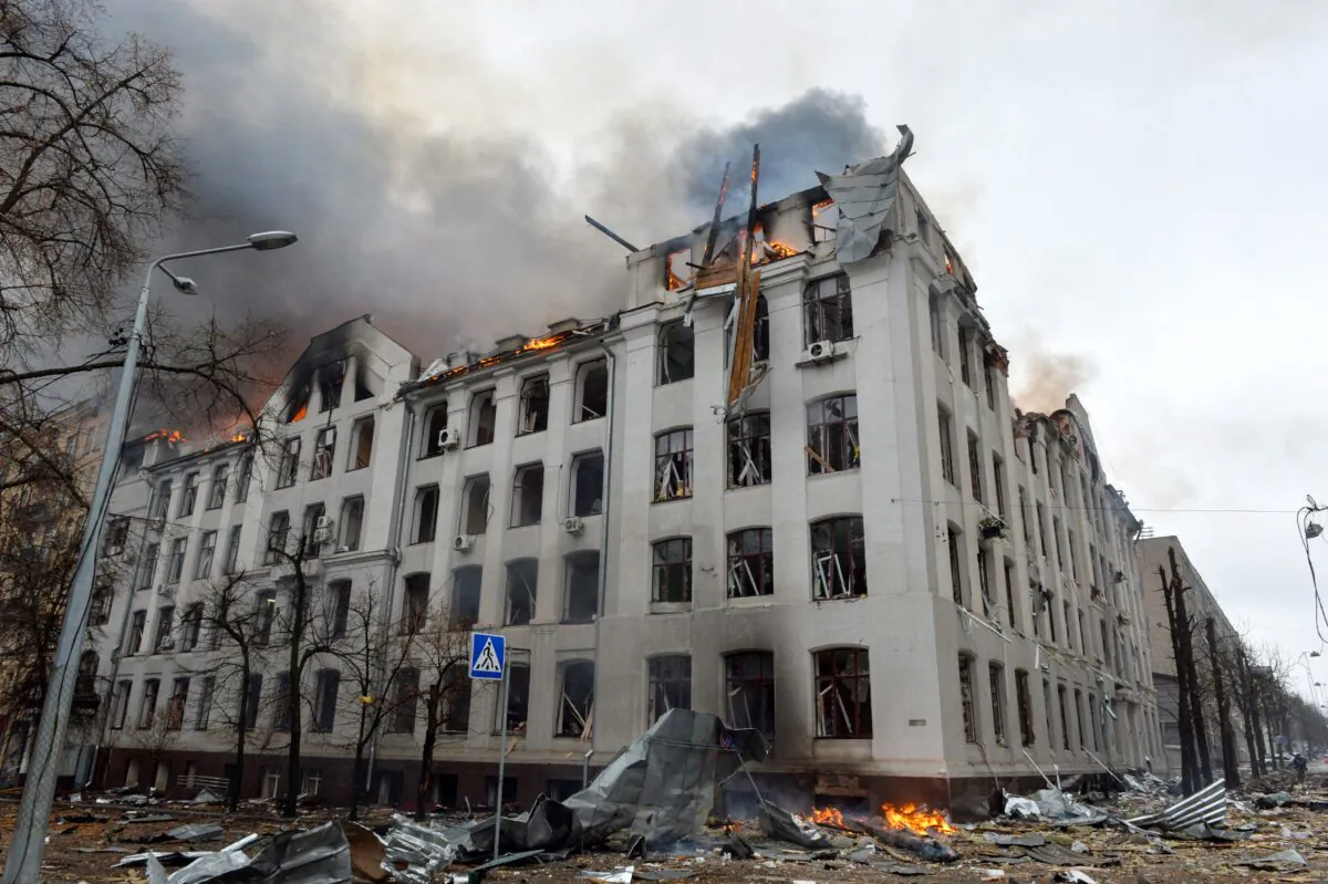 Smoke and flames rise on the Economy Department building of Karazin Kharkiv National University during the shelling in Kharkiv, as Russia continues its invasion of Ukraine, on March 2, 2022. (Sergey Bobok/AFP via Getty Images)