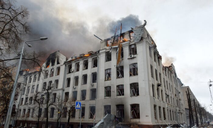 Smoke and flames rise on the Economy Department building of Karazin Kharkiv National University during the shelling in Kharkiv, as Russia continues its invasion of Ukraine, on March 2, 2022. (Sergey Bobok/AFP via Getty Images)