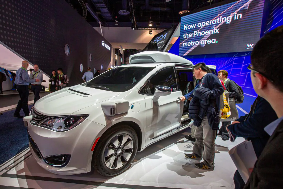 People look at the Waymo car, formerly the Google self-driving car project, during the Las Vegas Convention Center during CES 2019 in Las Vegas on Jan. 9, 2019. (David McNew/AFP/Getty Images)