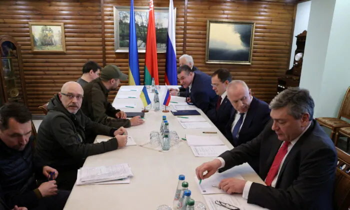 Russian and Ukrainian officials take part in talks in the Brest region, Belarus, on March 3, 2022. (Maxim Guchek/BelTA via Reuters)