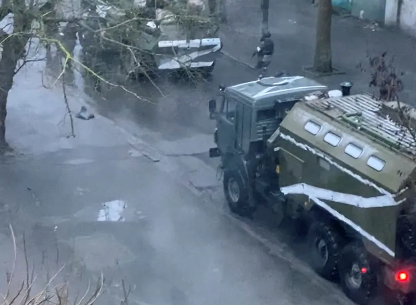 A military truck and tank are seen on a street of Kherson, Ukraine, on March 1, 2022. (Screenshot via Reuters)