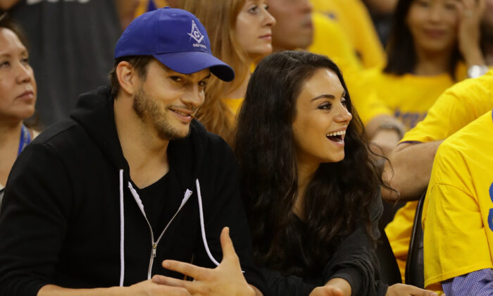 Actors Ashton (L) Kutcher and Mila Kunis attend Game 2 of the 2016 NBA Finals between the Golden State Warriors and the Cleveland Cavaliers at ORACLE Arena, in Oakland, Calif., on June 5, 2016. (Ezra Shaw/Getty Images)