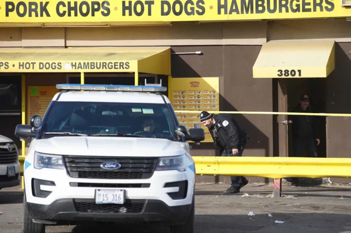 Chicago Police Department officials investigate an overnight shooting on the West Side in Chicago on March 4, 2022. (Pat Nabong/Chicago Sun-Times via AP)