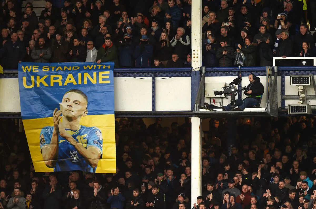 A banner that reads "We stand with Ukraine" is displayed during the English Premier League football match between Everton and Manchester City at Goodison Park in Liverpool, north west England on Feb. 26, 2022. (OLI SCARFF/AFP via Getty Images)