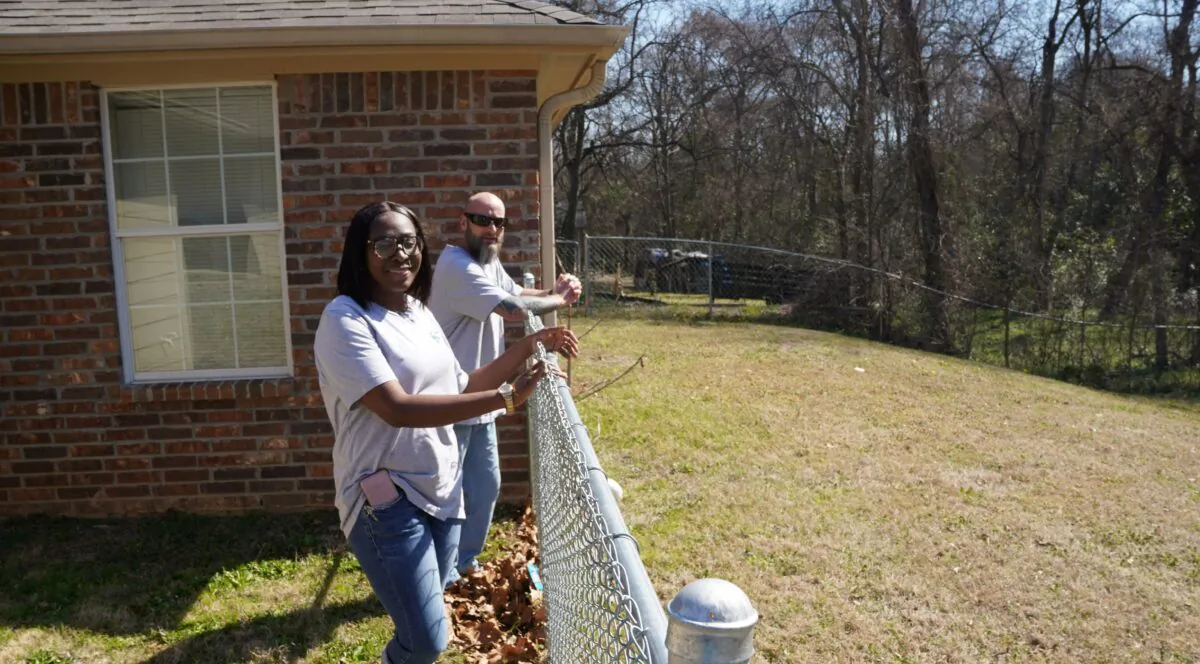 Nikki Pennington of PATH said homes built with HUD grants include a fenced-in back yard. None of the transitional homes are for sale, she said. She is pictured here with maintenance manager Todd Straley on March 3, 2022, in Tyler, Texas. (Patrick Butler/The Epoch Times)