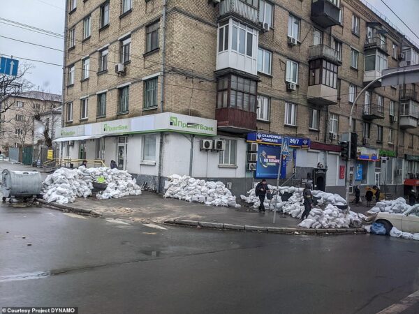 Citizens of Kiev, Ukraine attempt to fortify their homes with sandbags as Russian missiles and gunfire cut through the city in February 2022.