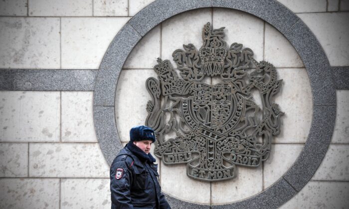 A police officer patrols outside the British embassy building in Moscow on March 14, 2018. (Alexander Nemenov /AFP via Getty Images)