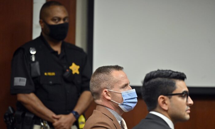 Former Louisville Police Officer Brett Hankison, center, awaits the jury's verdict in his wanton endangerment trial in Louisville, Ky., on March 3, 2022. (Timothy D. Easley/Pool/AP Photo)