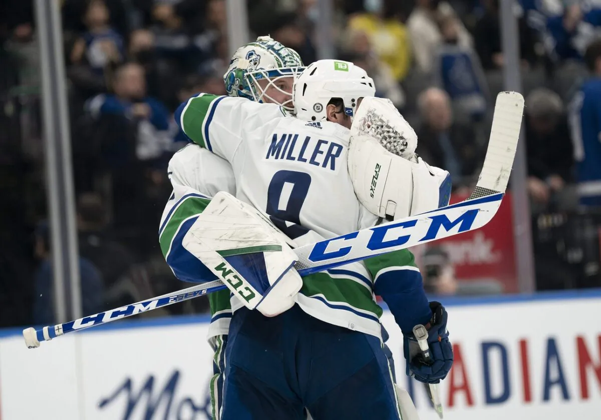 Vancouver Canucks goaltender Thatcher Demko (35) celebrates the win with center J.T. Miller (9) at the end of the third period against the Toronto Maple Leafs at Scotiabank Arena in Toronto on March 5, 2022. (Nick Turchiaro/USA TODAY Sports via Field Level Media)