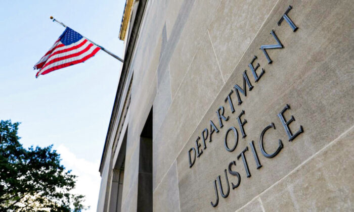 Signage is seen at the United States Department of Justice headquarters in Washington, on Aug. 29, 2020. (Andrew Kelly/Reuters)