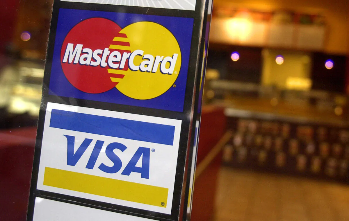 Logos for Mastercard and Visa in a file image. (Mark Lennihan/AP Photo)