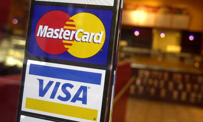 Logos for Mastercard and Visa in a file image. (Mark Lennihan/AP Photo)