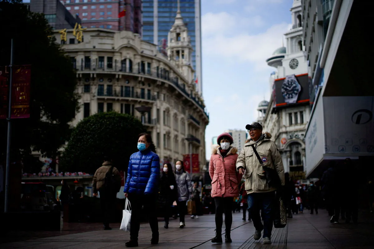 People wearing protective masks visit the main shopping area in Shanghai, China, on Jan. 21, 2022. (Aly Song/Reuters)