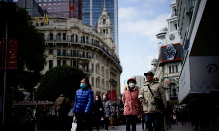 People wearing protective masks visit the main shopping area in Shanghai, China, on Jan. 21, 2022. (Aly Song/Reuters)