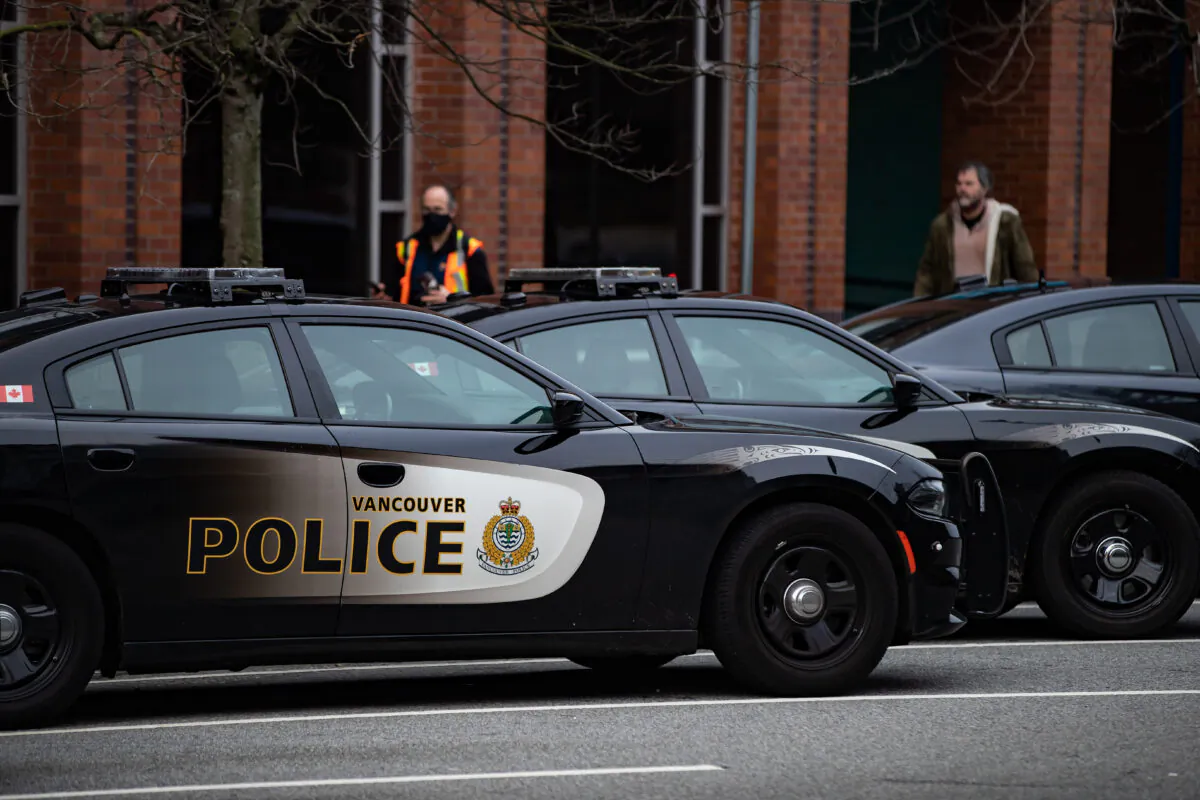 Police cars are seen parked outside Vancouver Police Department headquarters in Vancouver, on Jan. 9, 2021. (The Canadian Press/Darryl Dyck)
