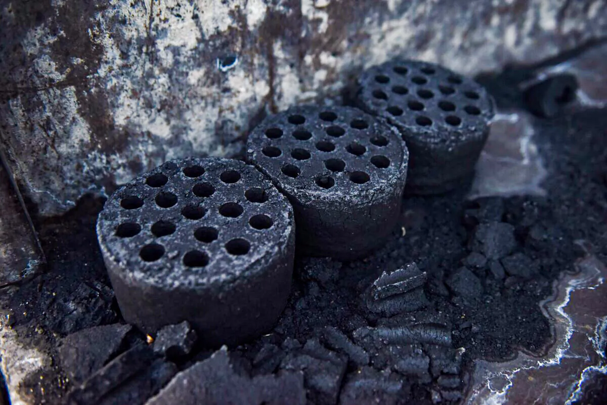 Coal briquettes in a file photo. (Greg Baker/AFP via Getty Images)