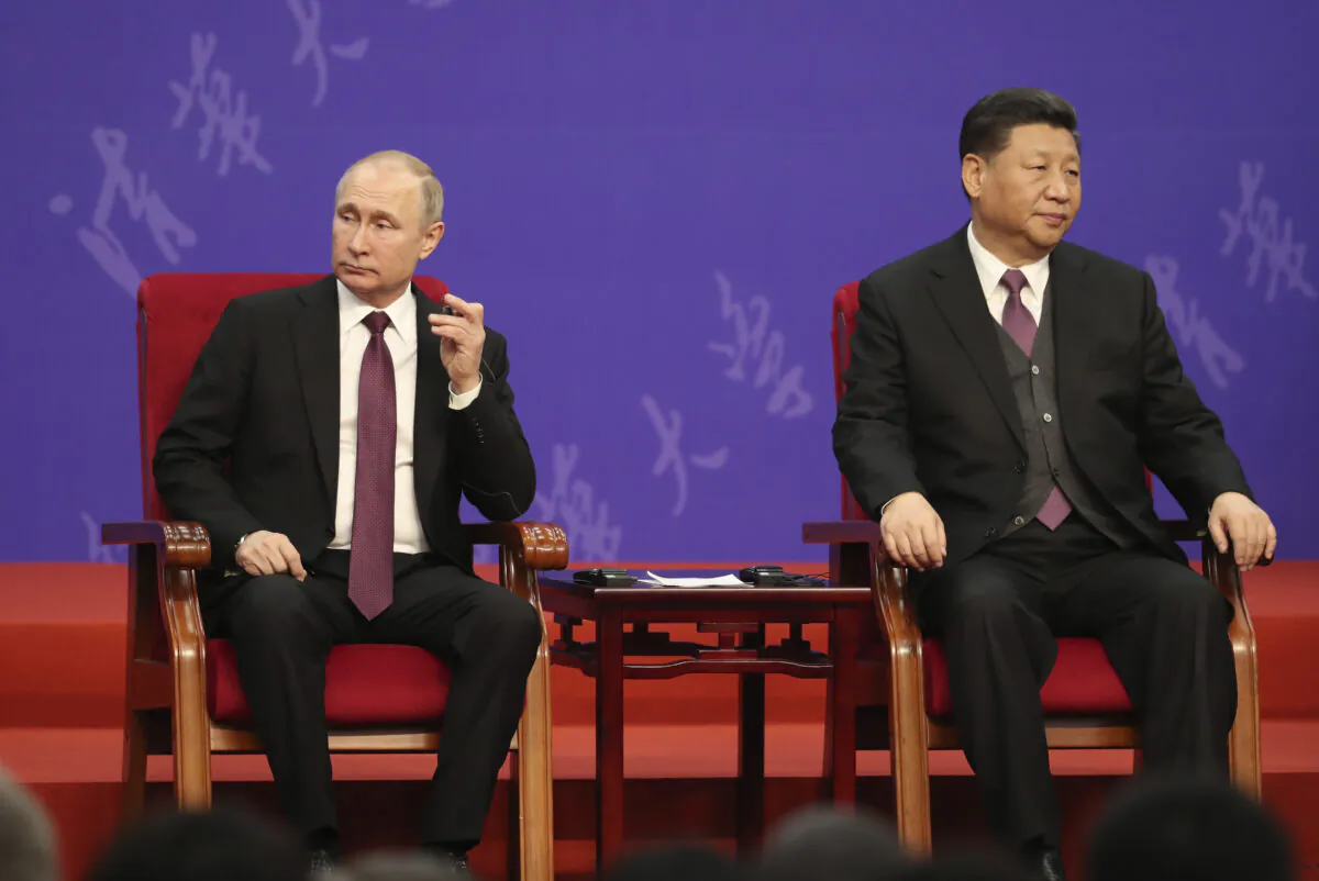 Russian President Vladimir Putin and Chinese leader Xi Jinping (R) attend the Tsinghua University's ceremony at Friendship Palace in Beijing, China, on April 26, 2019. (Kenzaburo Fukuhara/Pool/Getty Images)
