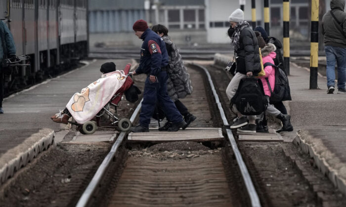 Refugees fleeing Ukraine arrive at Zahony train station in Zahony, Hungary, on March 7, 2022. (Christopher Furlong/Getty Images)