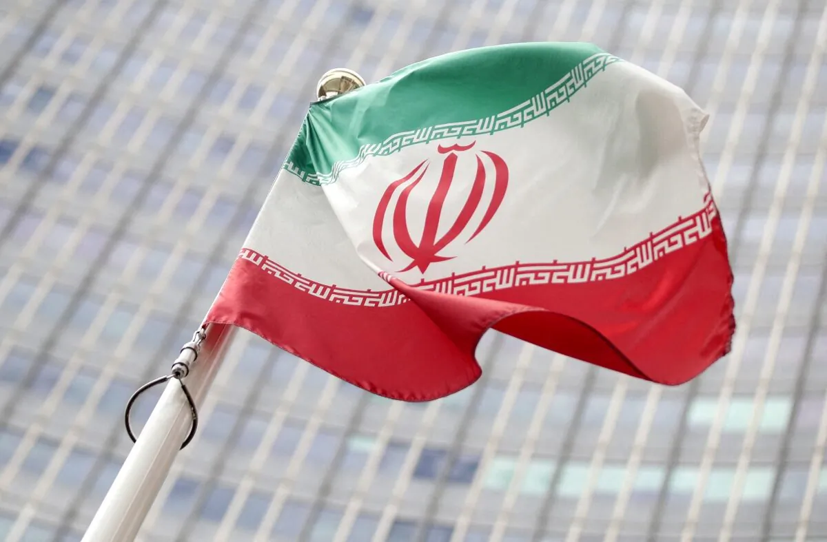 The Iranian flag flutters in front the International Atomic Energy Agency (IAEA) headquarters in Vienna, on July 10, 2019. (Lisi Niesner/Reuters)