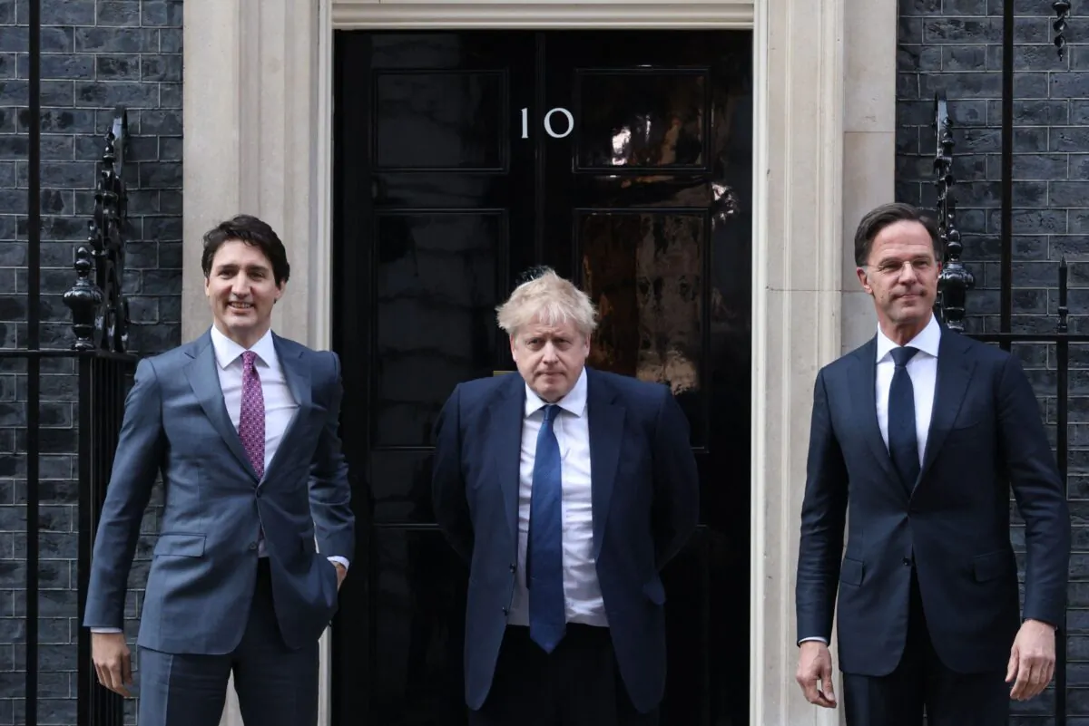 British Prime Minister Boris Johnson (C) poses with Canadian Prime Minister Justin Trudeau (L) and Dutch Prime Minister Mark Rutte (R) outside 10 Downing Street, in London, on March 7, 2022. (Adrian Dennis/AFP via Getty Images)
