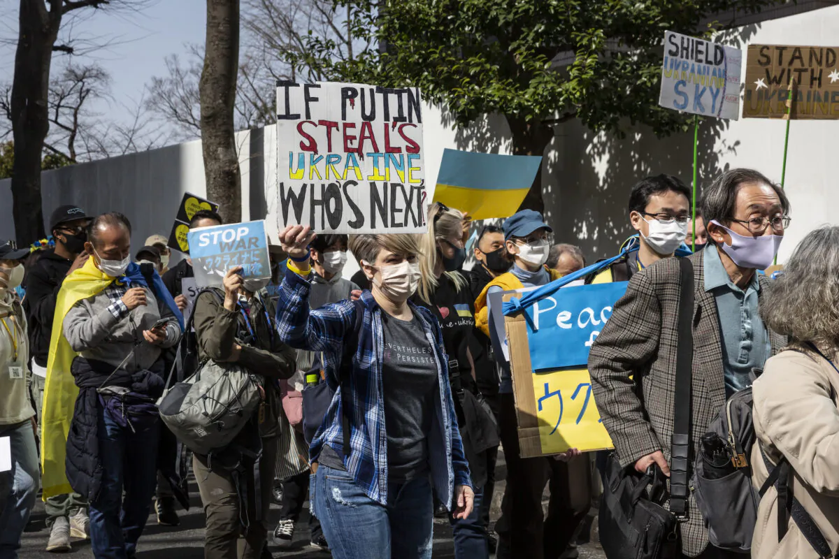 Protesters against the Russian invasion of Ukraine march through Shibuya area in Tokyo, Japan, on March 5, 2022. Protests have continued in Japan following Russia’s invasion of Ukraine. With over 1 million people now having fled the war, the Japanese government has announced that they will accept Ukrainian refugees. (Yuichi Yamazaki/Getty Images)