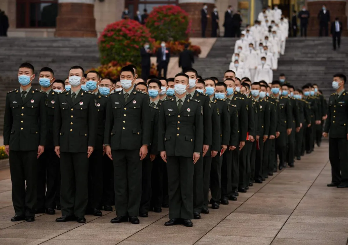 Military delegates stand in formation after the commemoration of the 110th anniversary of the Xinhai Revolution, in Beijing, China, on Oct. 9, 2021. (Noel Celis/AFP via Getty Images)